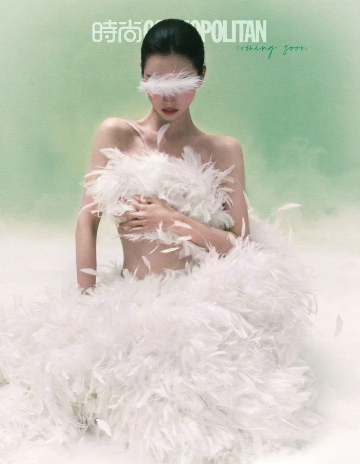 Chen Duling wearing a white feather dress against a soft green background for Cosmopolitan China