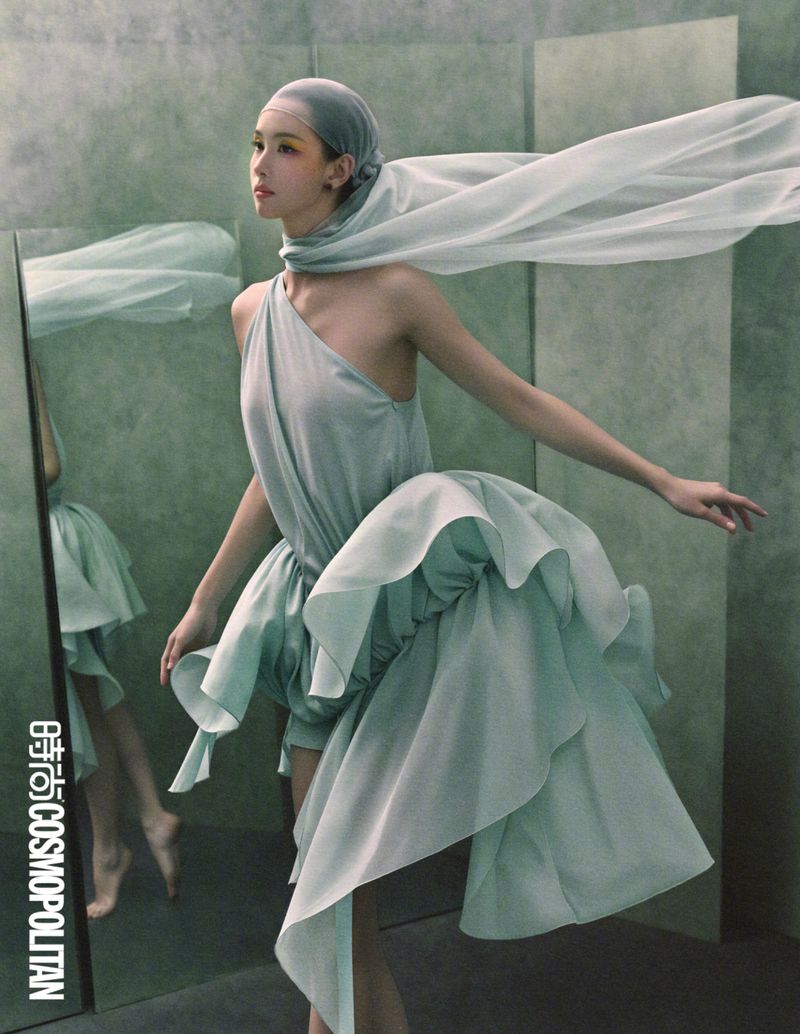 Chen Duling wearing a flowing light green dress and matching headscarf against a muted green studio backdrop for Cosmopolitan China