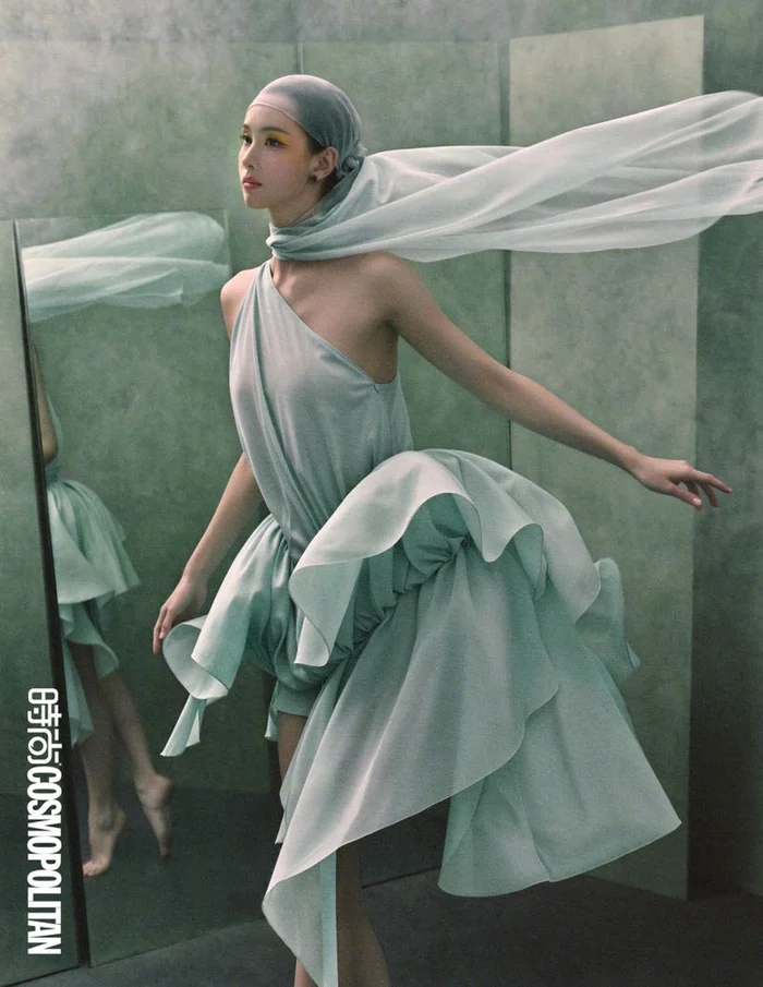 Chen Duling wearing a flowing light green dress and matching headscarf against a muted green studio backdrop for Cosmopolitan China