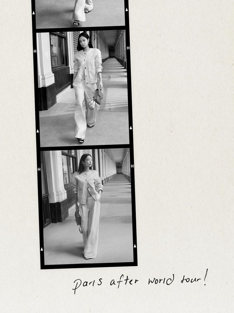 Black and white film strip featuring a woman in a light-colored pantsuit walking along a colonnade, carrying a small purse.