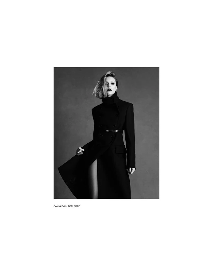 Model Anja Rubik wearing a black double-breasted coat in a monochrome fashion editorial portrait by Luigi & Iango