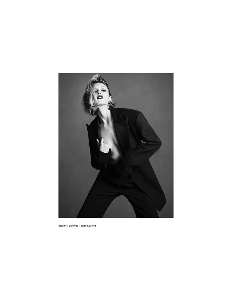 Model Anja Rubik wearing a black blazer in a black and white editorial photograph for Double Vision by Luigi and Iango.