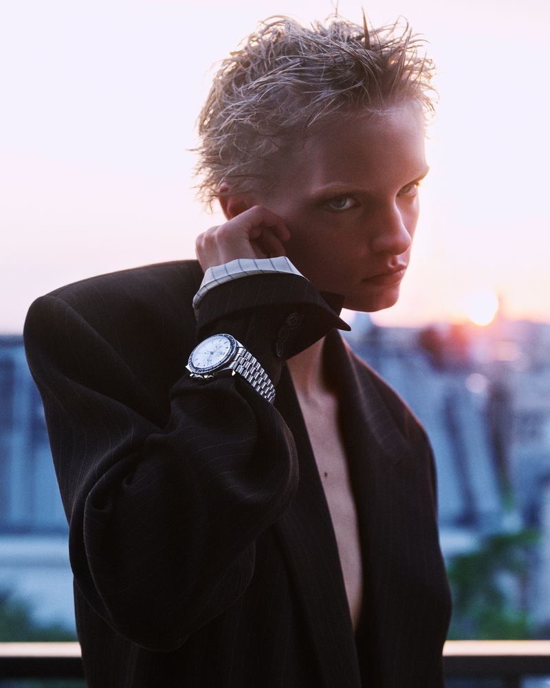 Model Gretchen Easterwood with short wet hair wearing a dark blazer and wristwatch in ReEdition magazine editorial