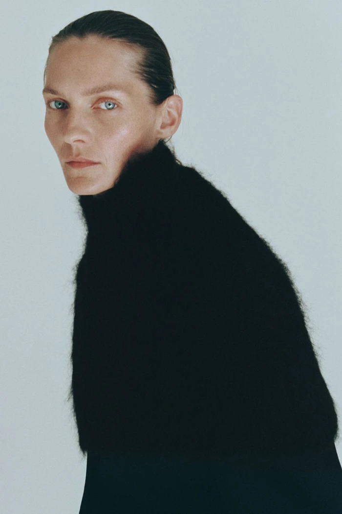Portrait of Karolin Wolter wearing a black turtleneck sweater against a plain white background for H&M