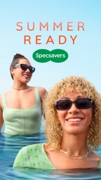 Two women wearing sunglasses while waist-deep in a pool under a clear blue sky, photographed by Seiya Taguchi for Specsavers.