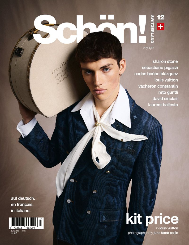 Schön! magazine cover featuring a young adult male model in a blue patterned jacket holding a round vintage suitcase on his shoulder.