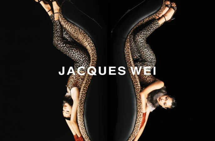 Fashion shot featuring two women mirrored with leopard print and black accents against a dark backdrop for Jacques Wei.