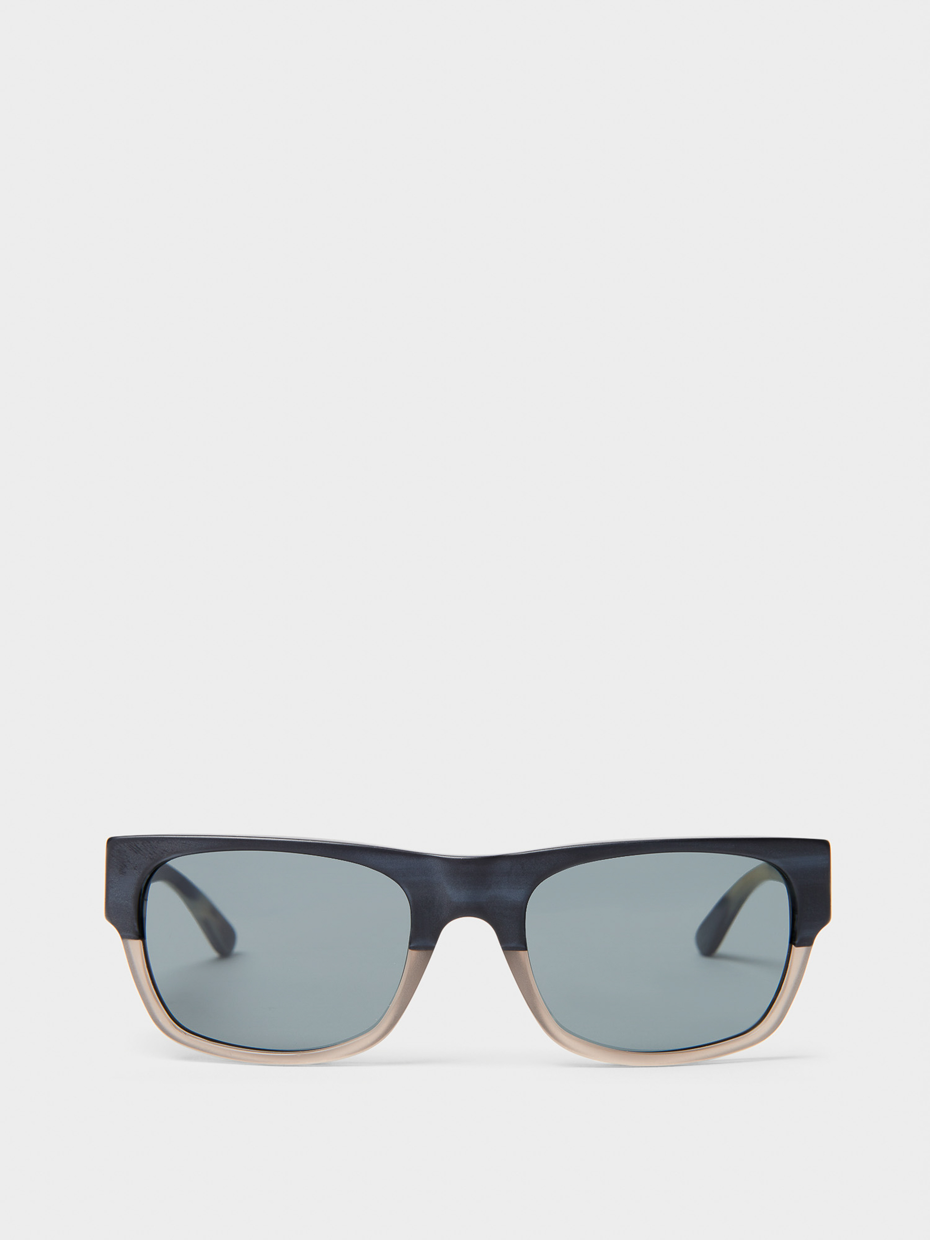 Close-up product shot of modern sunglasses with grey lenses, set against a bright white background. Fashion accessory, eyewear.