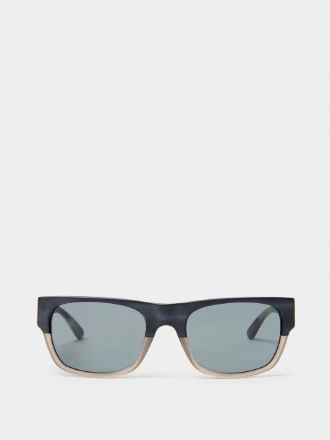 Close-up product shot of modern sunglasses with grey lenses, set against a bright white background. Fashion accessory, eyewear.