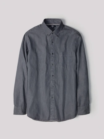Uniqlo dark grey long-sleeve button-down shirt displayed flat against a plain light grey backdrop.
