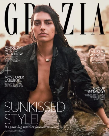 Grazia magazine cover featuring a model with wet hair wearing a black jacket in a waterside setting, with magazine text and headlines.