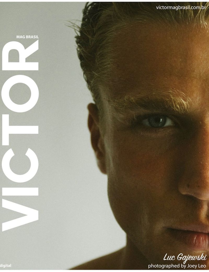 Magazine cover featuring a close-up portrait of Luc Gajewski with blond hair and blue eyes, set against a light gray background.