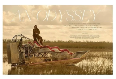 Model standing on top of an airboat in a grassy wetland under a cloudy sky for Red Magazine editorial An Odyssey