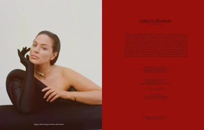 Ashley Graham wearing black opera gloves and gold necklace against white background for Love Want magazine editorial spread