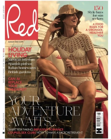 Magazine cover featuring a woman in crochet swimwear and a hat, smiling while sitting on a red and white seat outdoors on a sunny day.