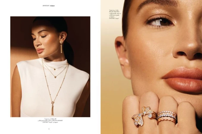 A woman showcases jewelry including earrings, necklaces, and rings, styled for a fashion advertisement, set against a gradient backdrop.