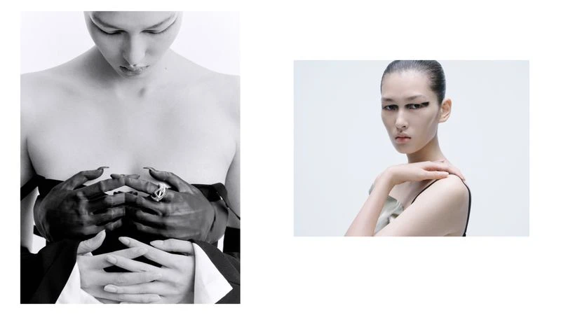 Monochrome studio shot featuring two adult women with slicked-back hair and minimal makeup, one wearing a statement ring.