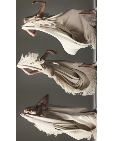 Fashion shot features a woman wearing a draped, off-white dress with fringe in three different poses against a gray backdrop.