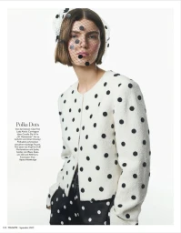 Model wearing a white polka dot jacket and matching veiled headpiece against a plain white background for Madame Germany Role Models.