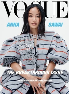 Anna Sawai on the cover of Vogue Australia wearing a structured grey patterned jacket with voluminous sleeves.
