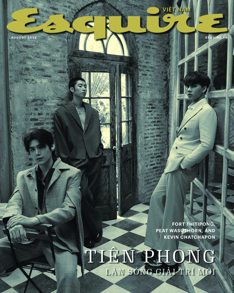 Esquire Vietnam magazine cover featuring three young adult men in stylish suits posing indoors with brick and window background.