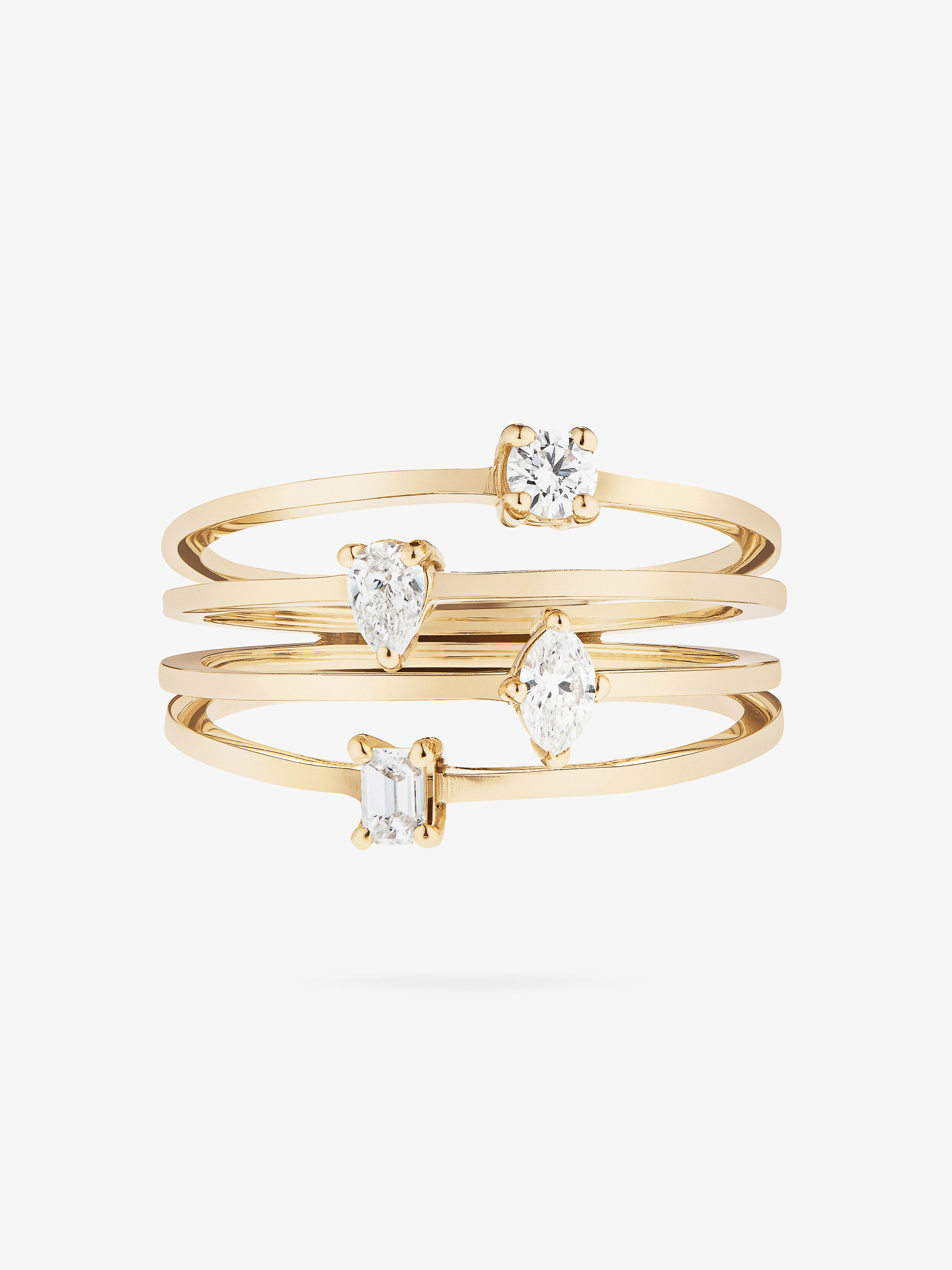Stack of four gold rings, each featuring a different cut diamond, on a white background. Jewellery, rings, diamonds, and gold.