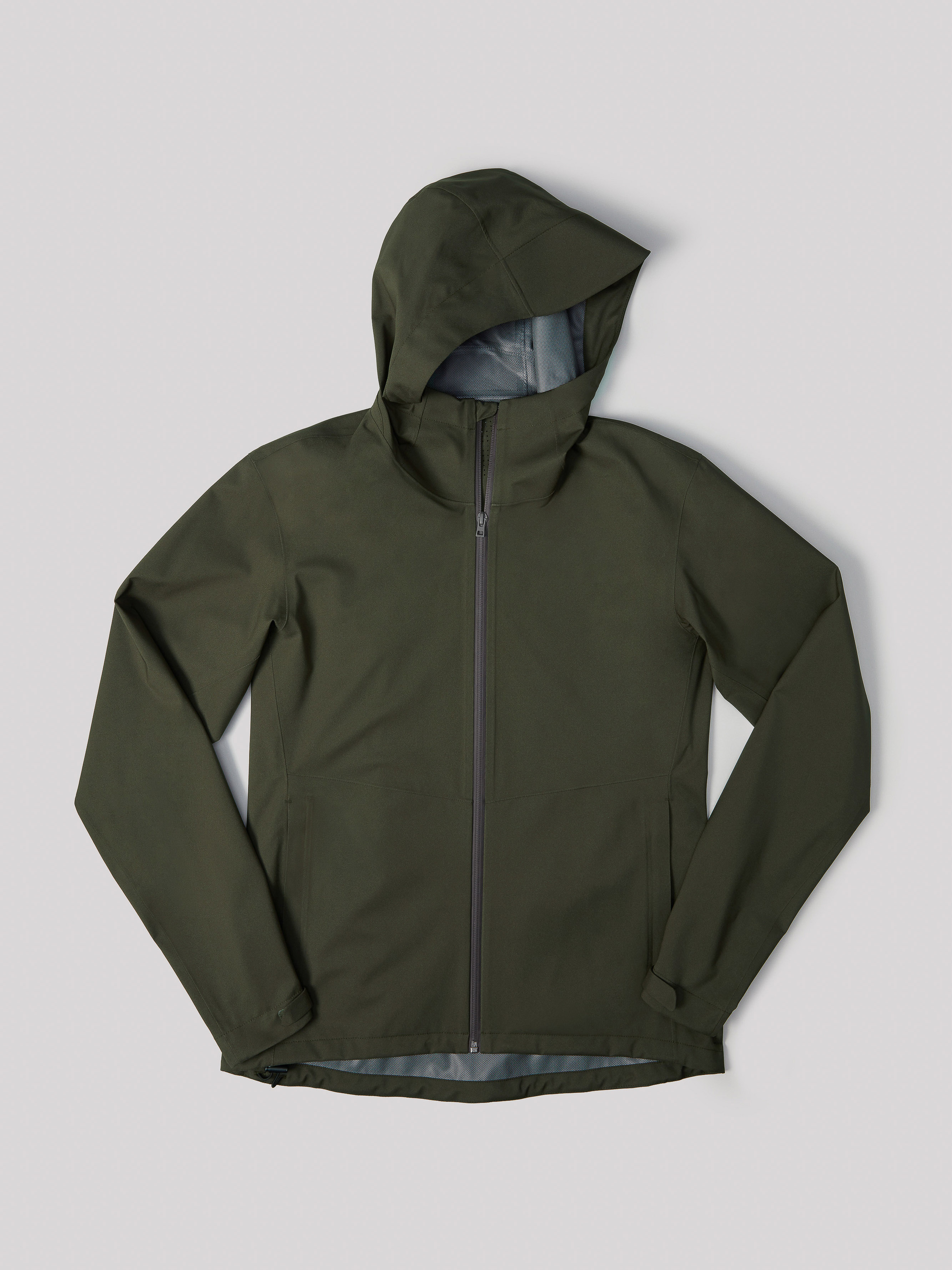 Olive green hooded jacket on a neutral background, showcasing its design, material, and style in a studio-lit product shot.