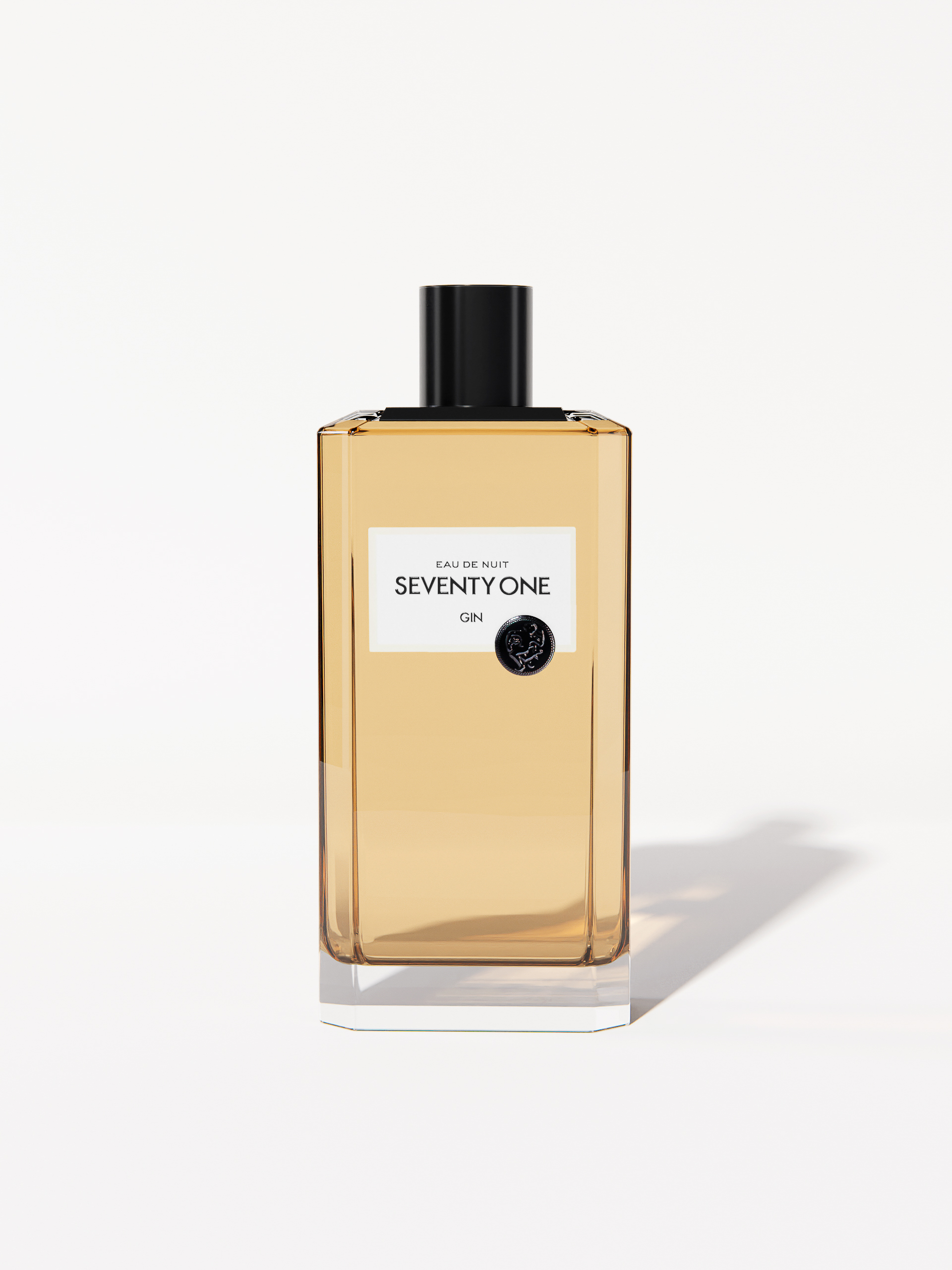 Studio shot of rectangular Seventy One Gin bottle with black cap, pale-amber liquid inside, label in white against a clean white backdrop.