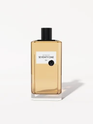 Seventy One Gin bottle with amber liquid and a dark cap against a clean white background