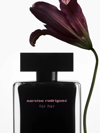 Narciso Rodriguez For Her perfume bottle with a dark floral accent, product shot with a clean, minimalist aesthetic, beauty advertisement.