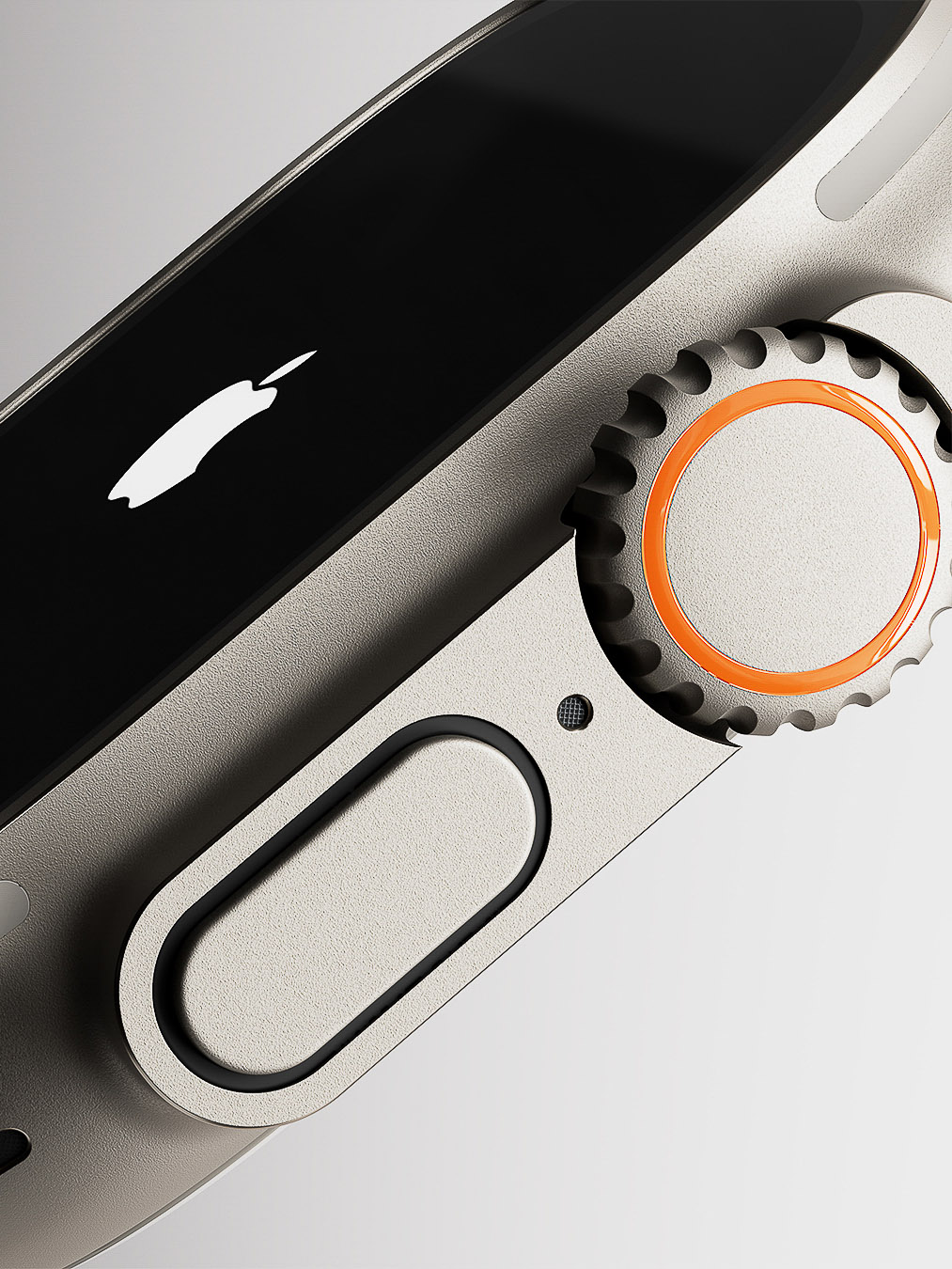 Macro studio shot of a titanium Apple Watch Ultra with an orange action button and crown, showcasing its sleek design and functionality.