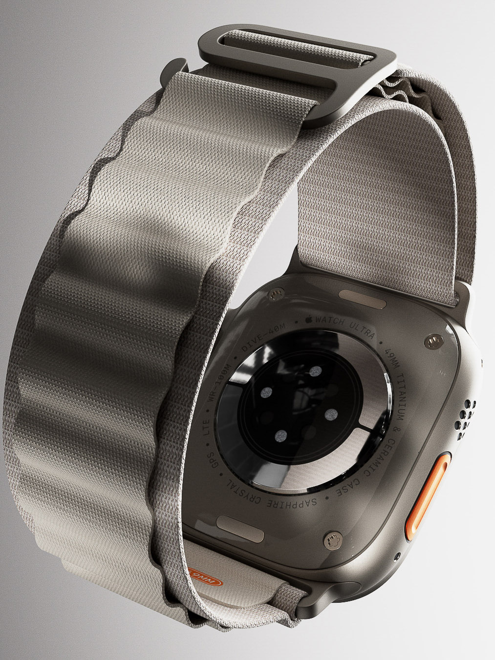 Smartwatch detail with gray woven band and titanium case. Close-up product shot on white showcasing the watch's design.