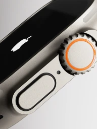 Close-up CGI render of the Apple Watch Ultra titanium side profile showing the Digital Crown with orange ring and glowing logo.