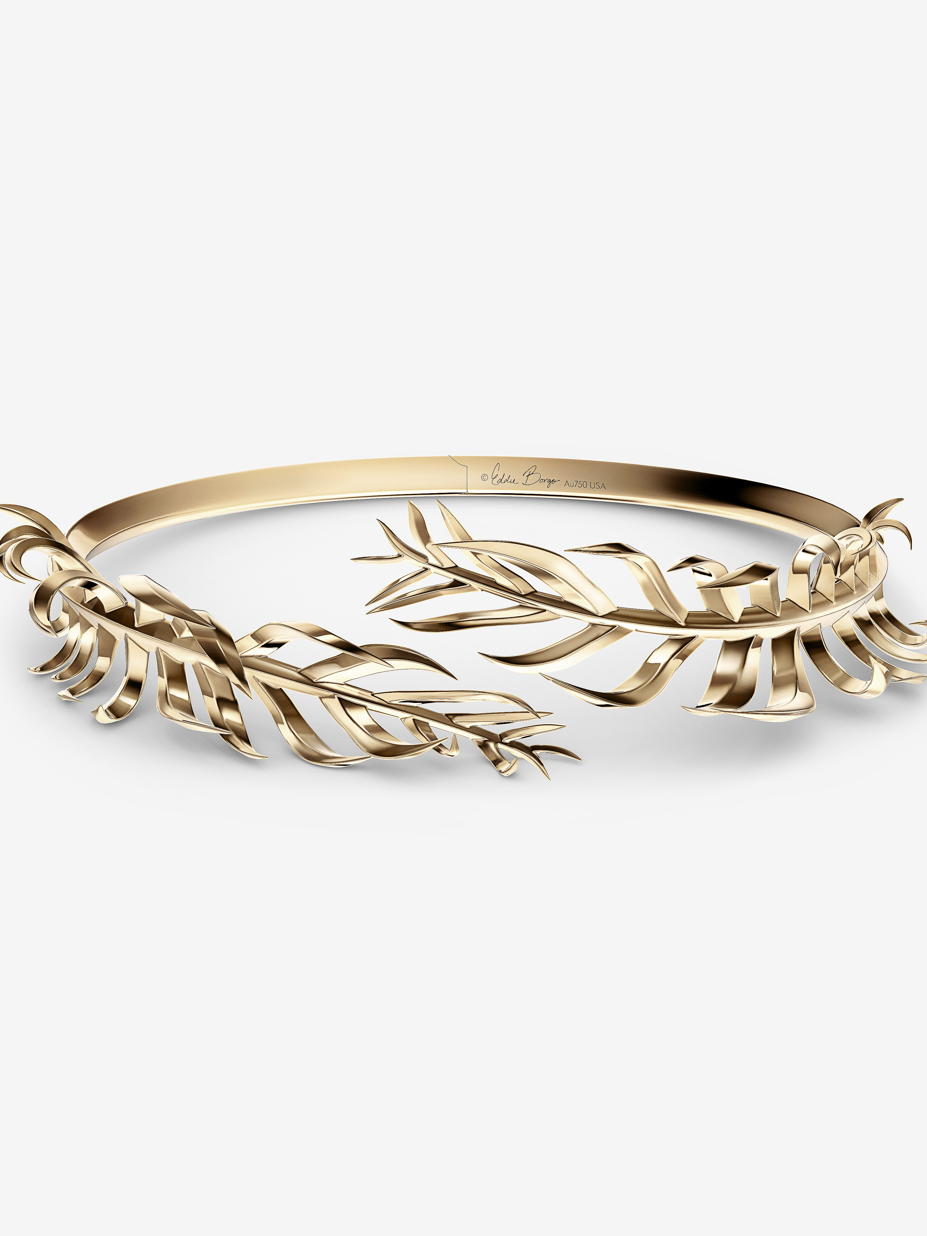 Elegant gold-toned metal headpiece with stylized leaf designs on a white background, perfect for fashion and beauty visuals.