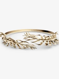 Polished gold botanical leaf choker necklace by Eddie Borgo displayed on a clean white background.