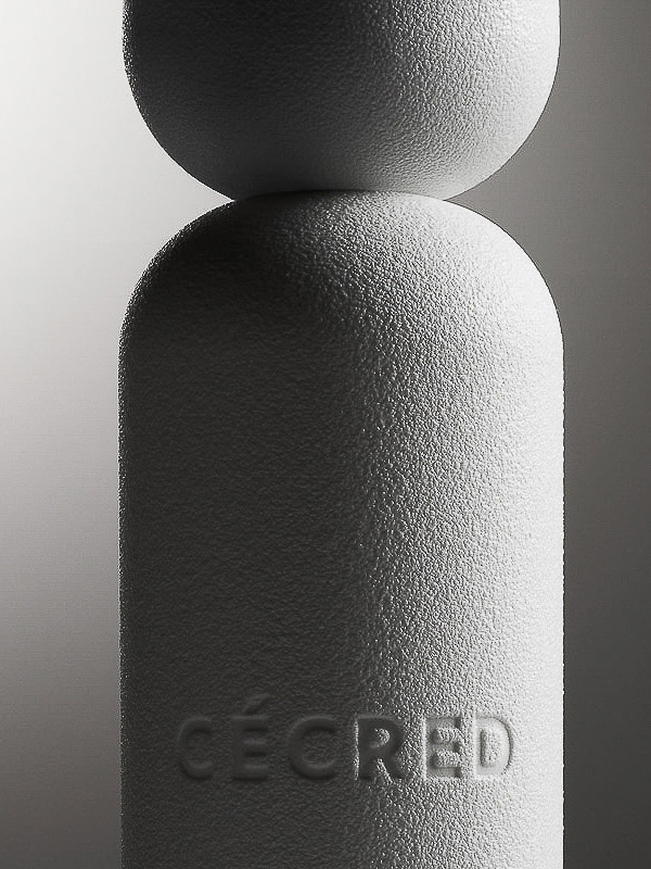 Close-up of a textured white sculpture featuring stacked geometric shapes—a sphere on top of a capsule shape—against a gradient background.