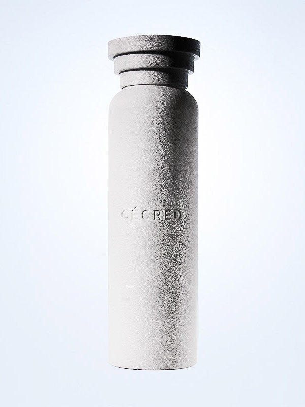 Minimalist bottle with the word 'CECRED' vertically printed. The bottle is gray with a unique top design and a light background.
