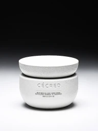 Cécred Moisturizing Deep Conditioner textured off-white jar with matching lid centered against a dark gradient studio background.