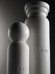 Two textured off-white Cécred product bottles with debossed logos against a dramatic dark studio background.