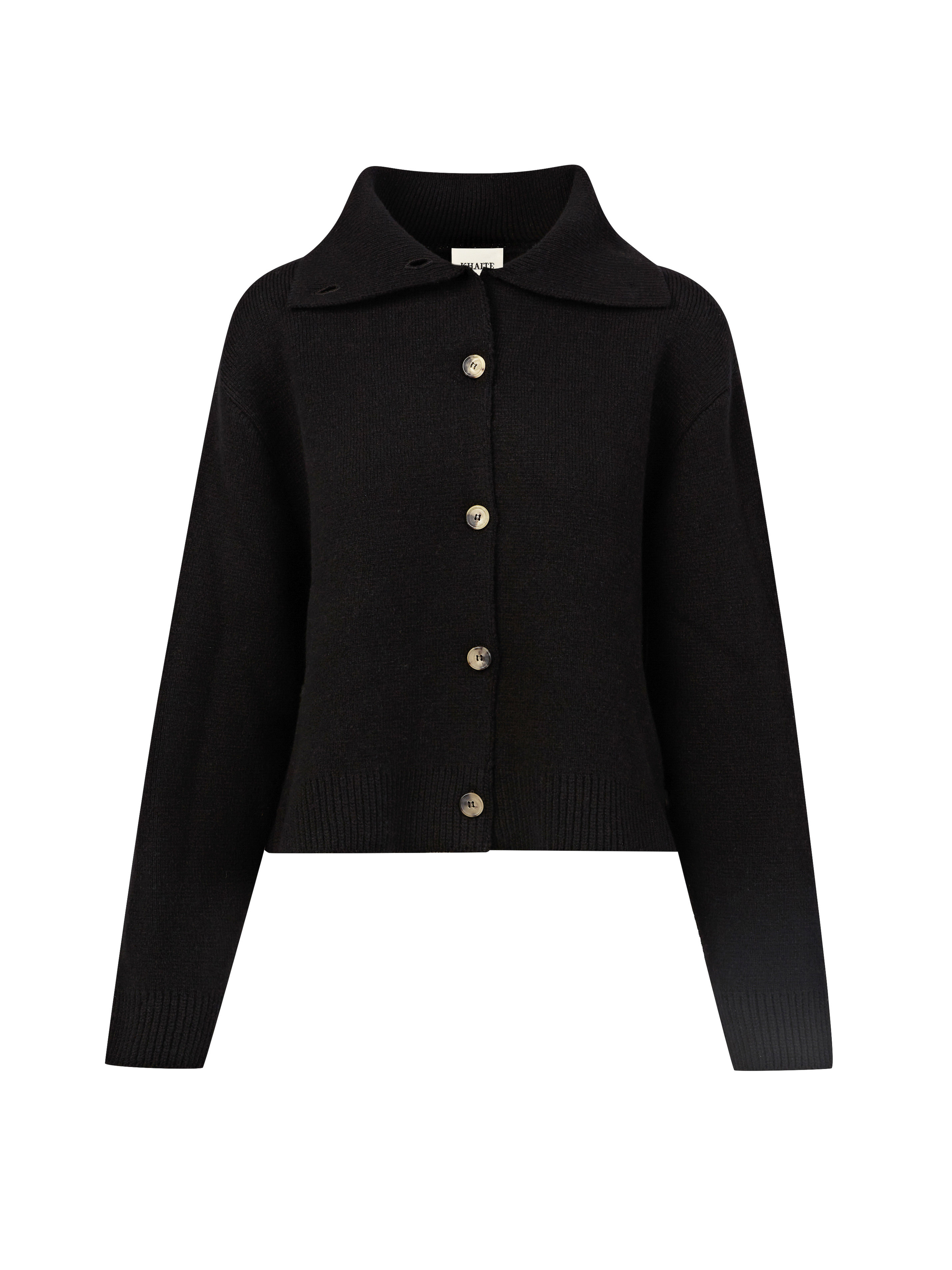 Close-up shot of a black, button-down cardigan with a collared neckline and a ribbed knit texture, presented against a plain white backdrop.