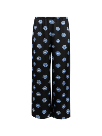 Full shot of wide-leg pants with blue lips pattern on black fabric. Fashionable trousers for stylish women, perfect for casual wear.