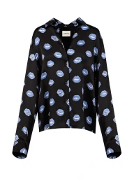 Black long-sleeved button-up silk shirt patterned with blue lip prints displayed against a plain white background.
