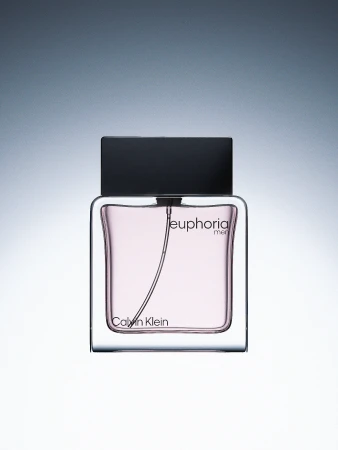 Close-up studio shot of a Calvin Klein Euphoria Men's fragrance bottle on a white background, showcasing the product's design.