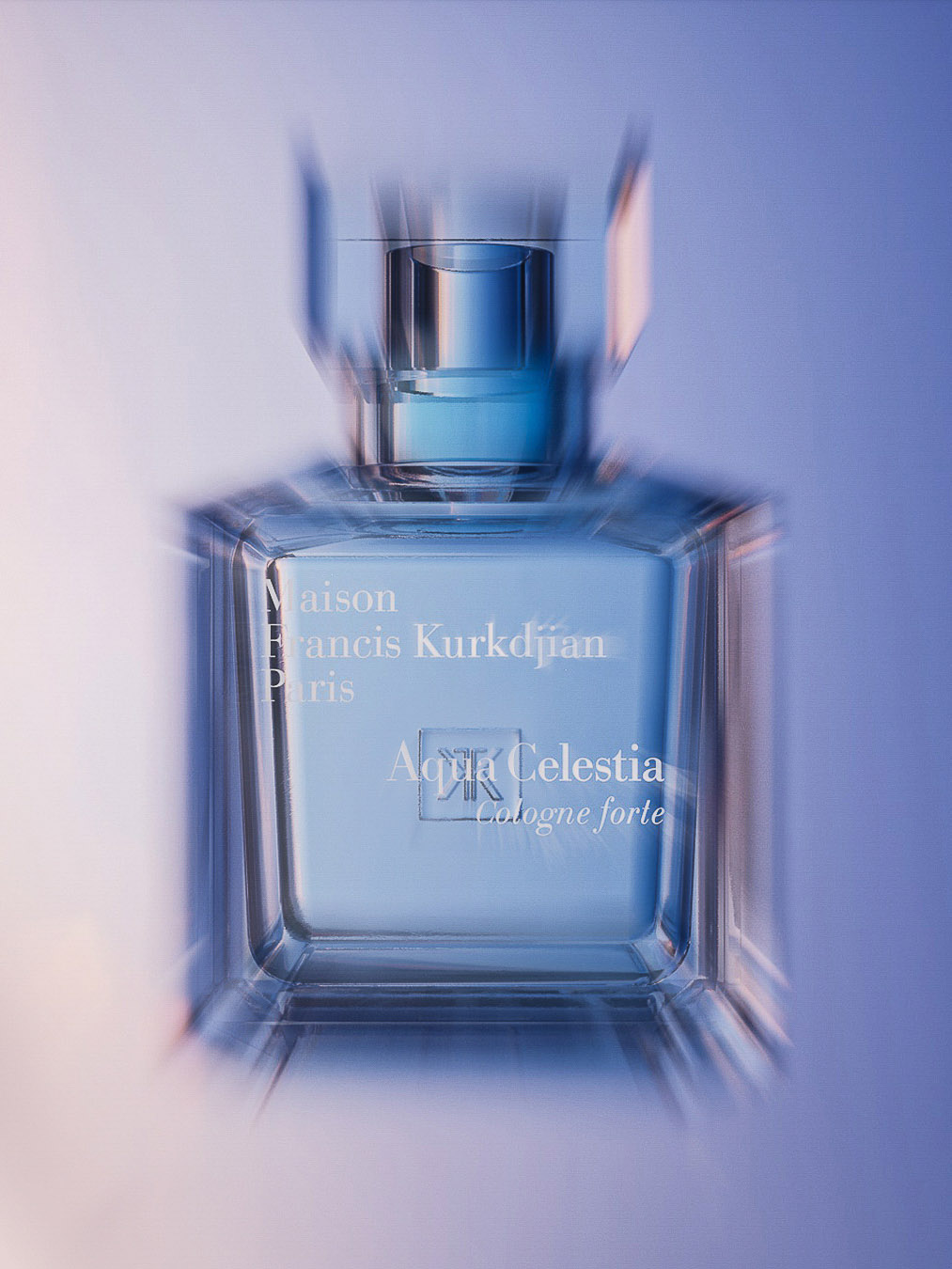 Still life studio shot of a Maison Francis Kurkdjian Aqua Celestia Cologne Forte perfume bottle on a gradient blue background.