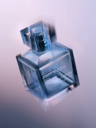 Maison Francis Kurkdjian Aqua Celestia cologne bottle with a square glass design against a gradient purple background in studio lighting.