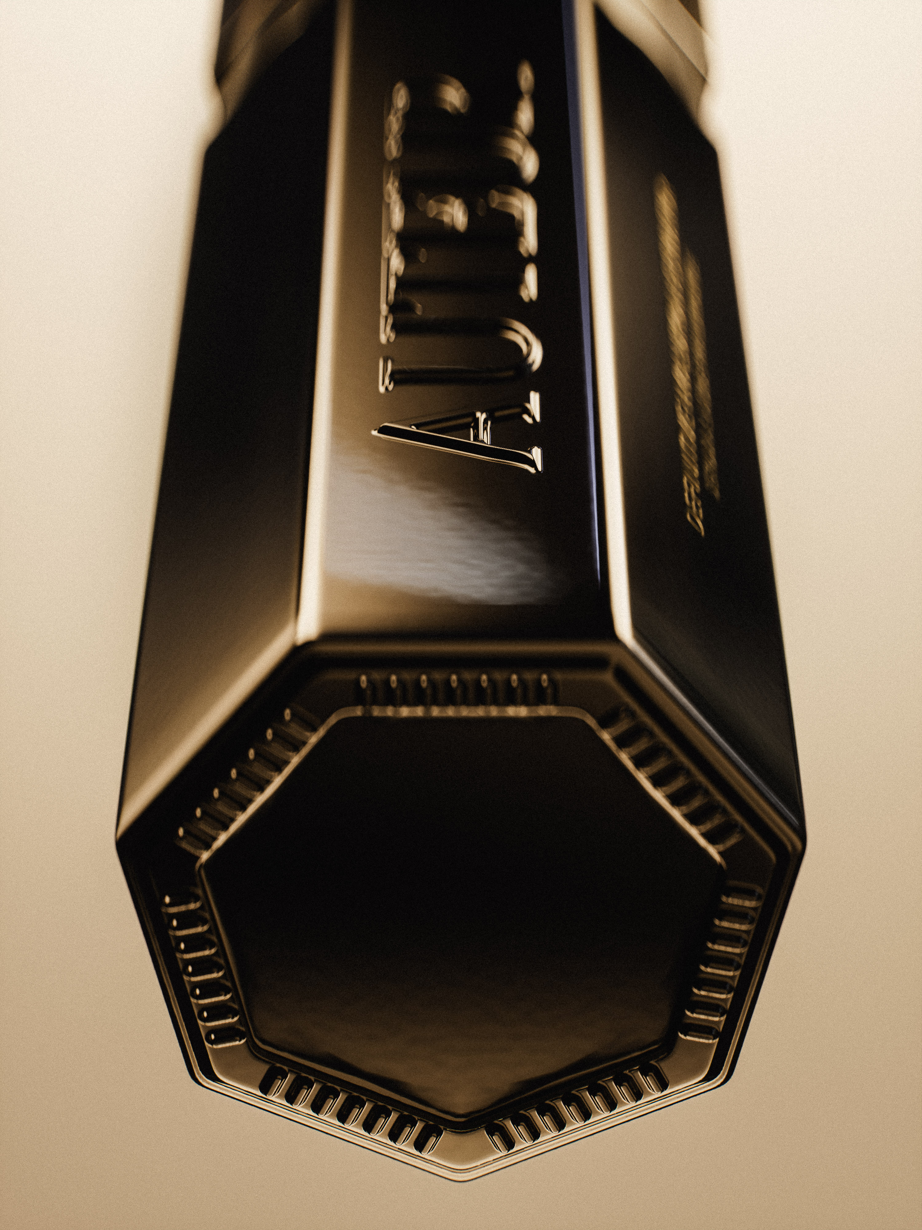 Close-up of a black, multi-faceted perfume bottle with a metallic sheen against a beige background, showcasing its geometric design.