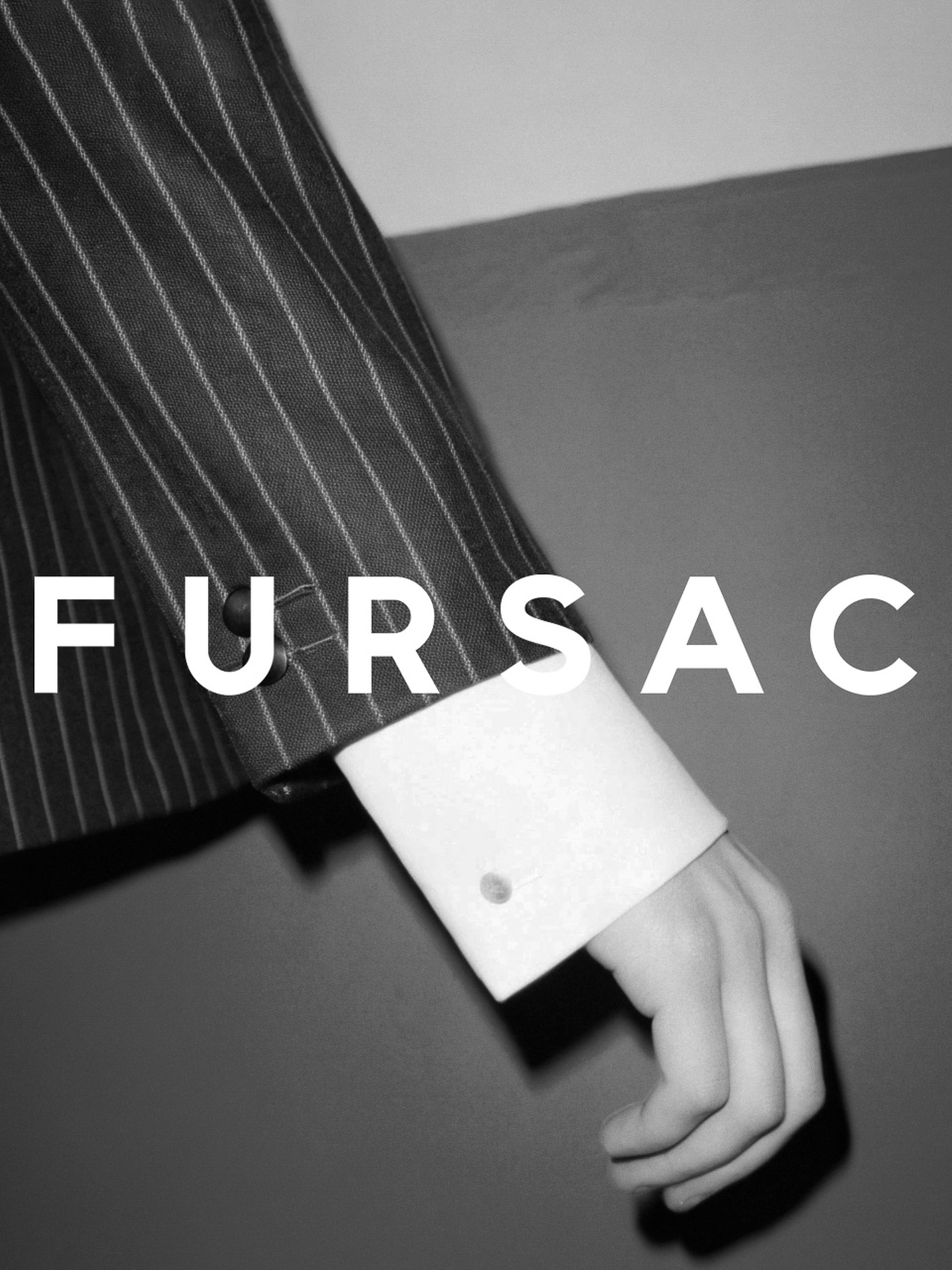 A suit sleeve and cuff are displayed next to the logo for Fursac in a black and white image, creating a fashion-forward look.
