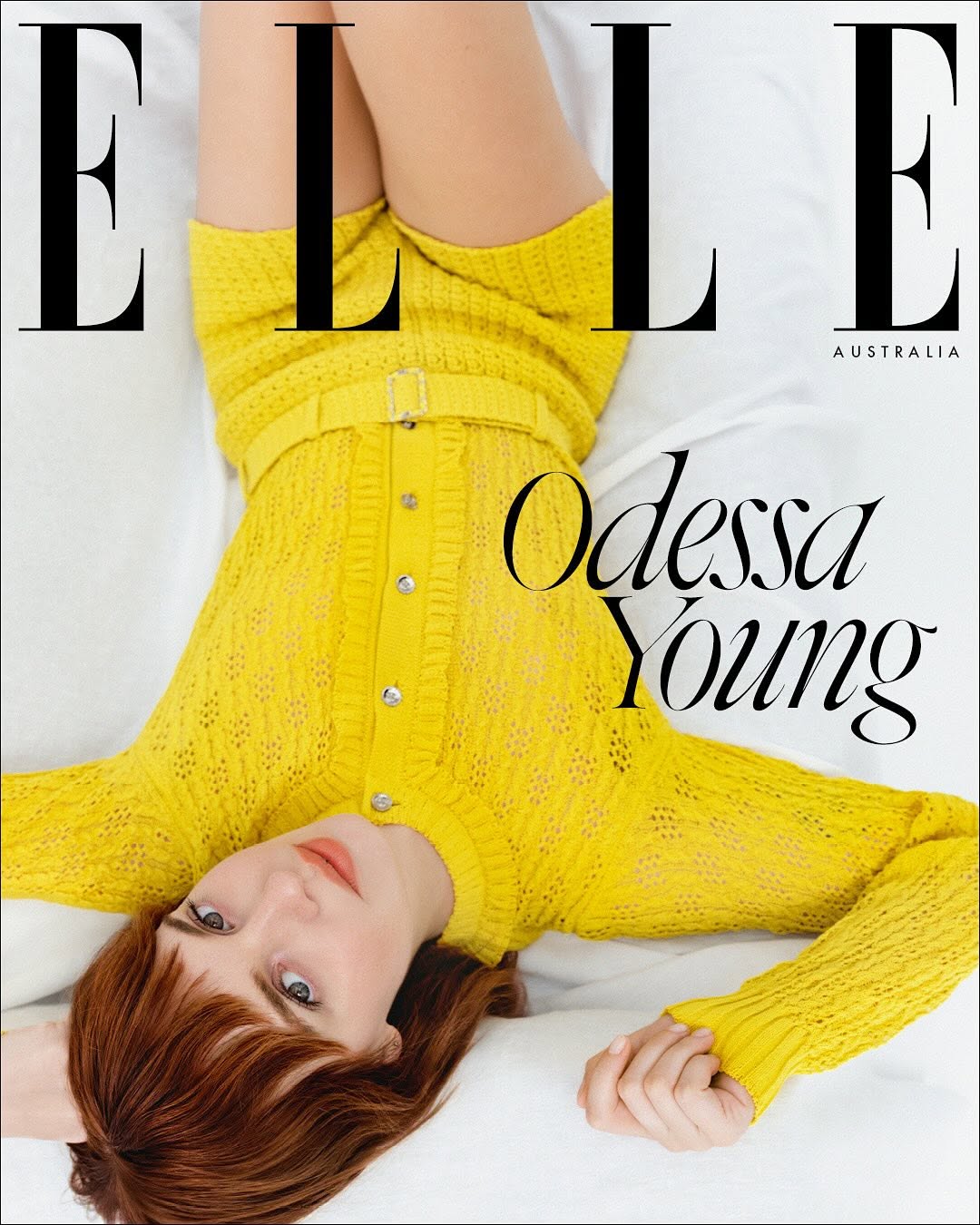 Elle Australia cover featuring Odessa Young wearing yellow knitted dress, laying on white surface, studio lighting, fashion, beauty.