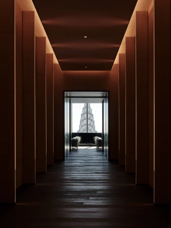 Architectural view of a dark hallway with wood floors leading to a window framing the Chrysler Building, creating a sense of depth and perspective.