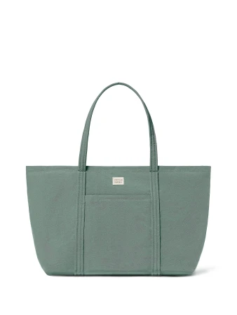 Close-up studio shot of a sage green tote bag with a pebbled texture, featuring dual handles and a rectangular silhouette.
